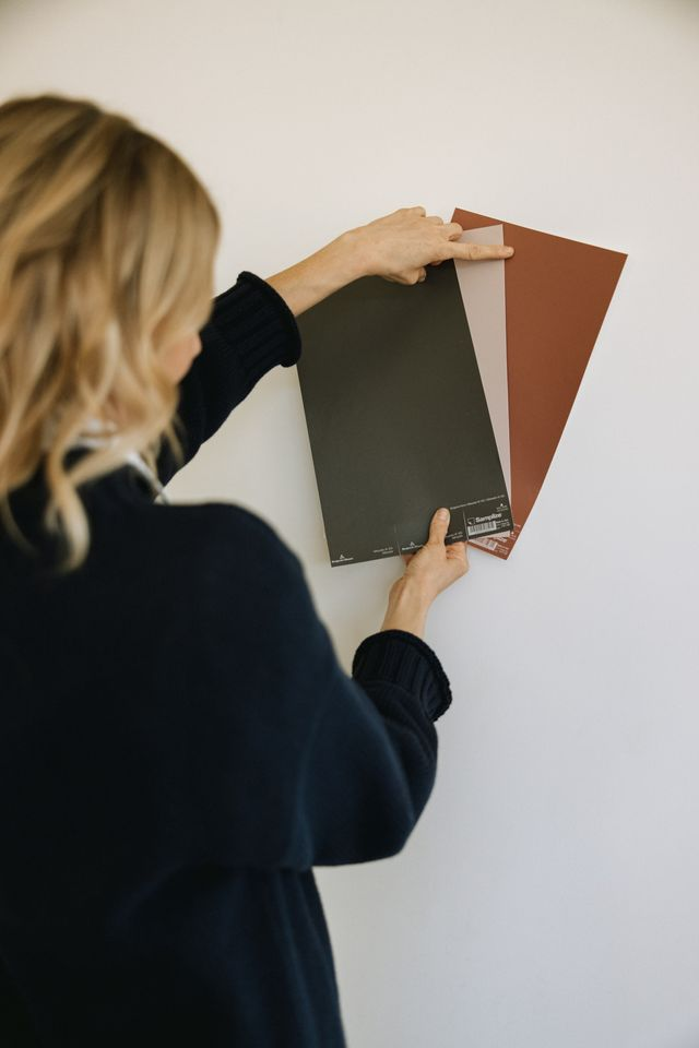 Samplize peel-and-stick paint samples compared against a light wall